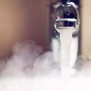 Domestic hot water temperature UK – a picture showing hot water flowing out of a tap
