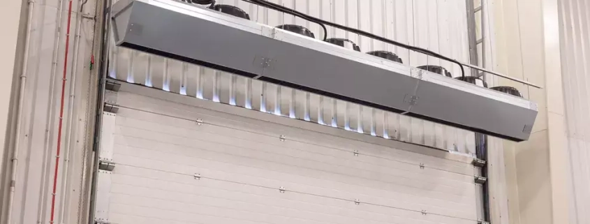 Industrial air curtains or air doors heated or ambient air for distribution centres and warehousing using an energy efficient high airflow fan to protect the indoor air from the exterior environment Flexiheat UK