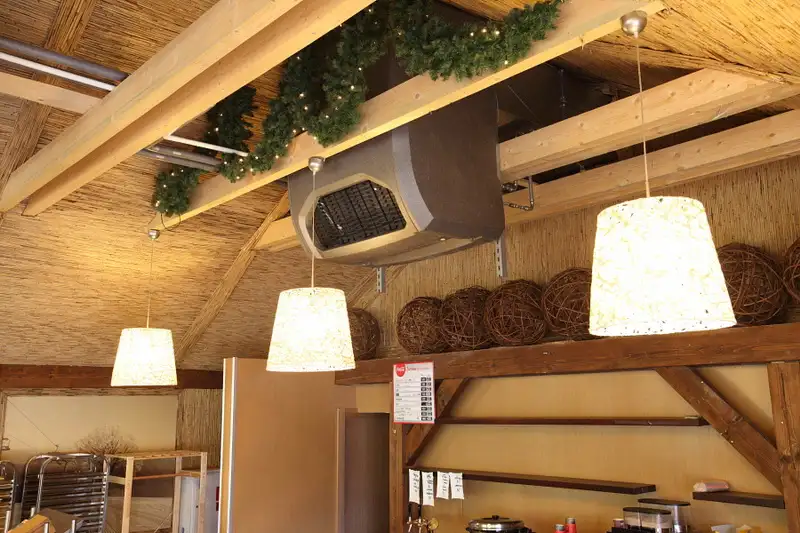 A picture of a commercial heat recovery unit in a restaurant which absorb exhaust heat energy from the cookers and kitchen equipment via a heat recovery element and supply fresh filtered air back to the area.