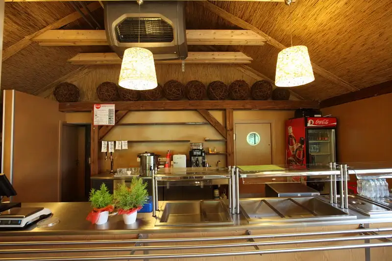 A picture of a commercial heat recovery unit in a restaurant which absorb exhaust heat energy from the cookers and kitchen equipment via a heat recovery element and supply fresh filtered air back to the area.