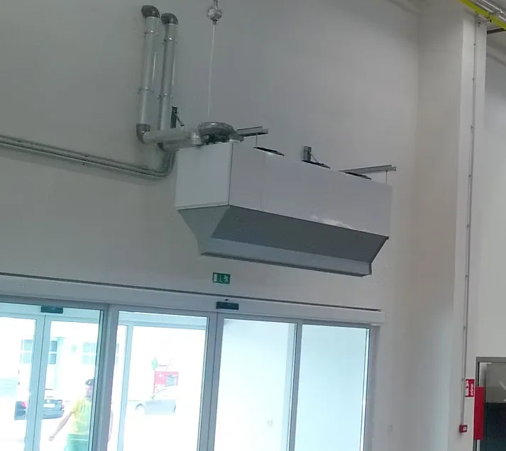 Indirect gas heated air curtain - gas fired air curtain installation picture from Flexiheat UK